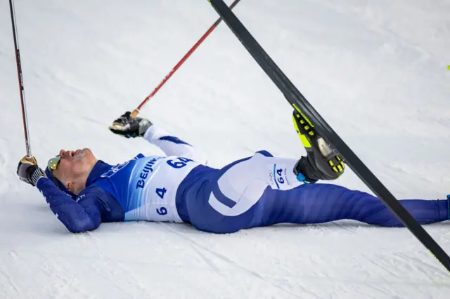 Cross country skiier on the floor with fatigue