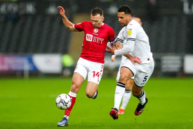 Bristol's goalscorer Andreas Weimann is challenged by Ben Cabango