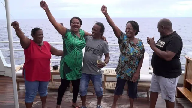 Chagossians on a boat celebrating