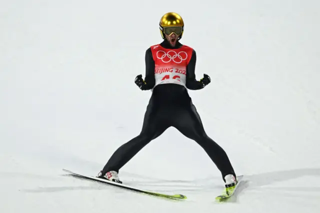 Markus Eisenbichler cheering after his landing