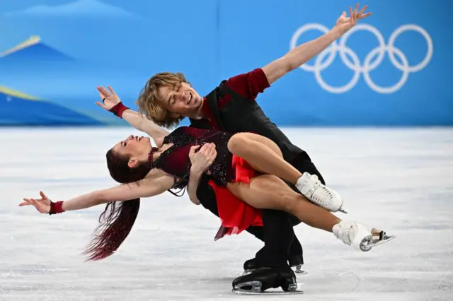 Figure skaters embrace