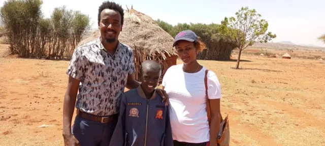 Ethiopian boy with well-wisher Muna