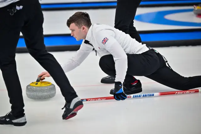 Mouat of Team GB curling a stone