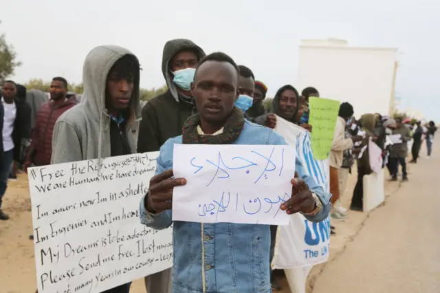 Irregular migrants stage a demonstration in front of the UNHCR building demanding better life conditions and accommodation rights in Europe in Zarzis, Tunisia on February 14, 2022.