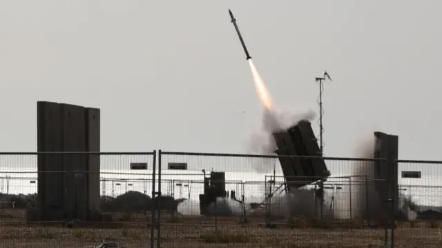 Israeli Iron Dome battery launches an interceptor missile at a rocket fired by Palestinian militants in the Gaza Strip (11 May 2021)