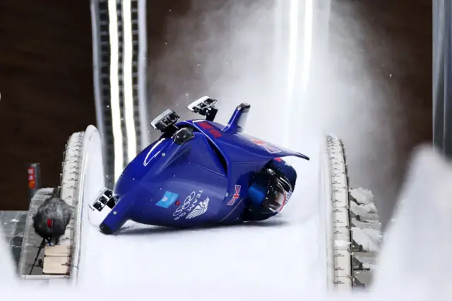 Team GB Two man bobsleigh crash and on side on track