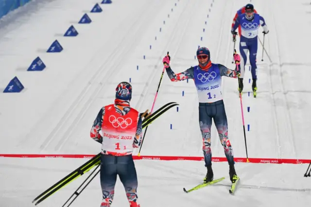 Norway's Johannes Klaebo celebrates winning on the line