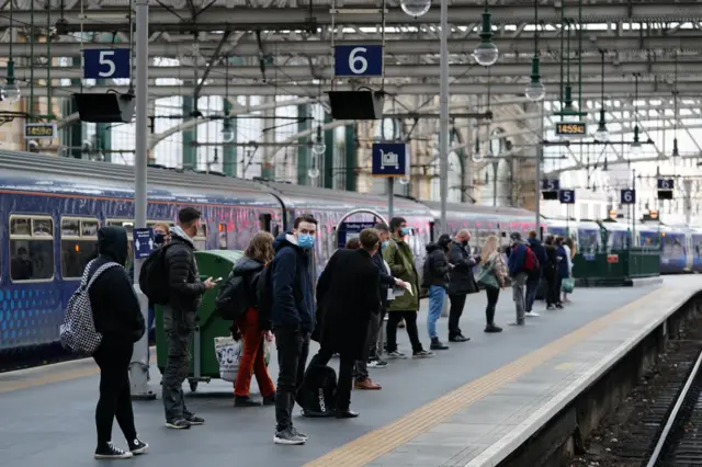 Passengers waiting on a train at Glasgow Central