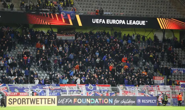 The small band of Rangers fans gather inside the stadium