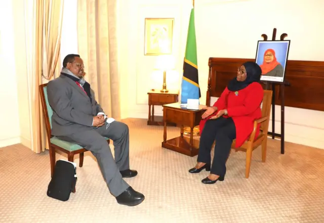 Opposition leader Tundu Lissu talks to President Samia Suluhu