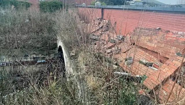 Collapsed wall near Metro line