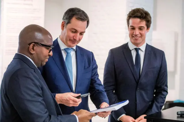 DR Congo's Prime Minister Jean-Michel Sama Lukonde, Belgium's Prime Minister Alexander De Croo and Belgium's State Secretary for scientific policy Thomas Dermine speak during the presentation of the inventory of museum pieces at the AfricaMuseum in Tervuren on the outskirts of Brussels on February 17, 2022