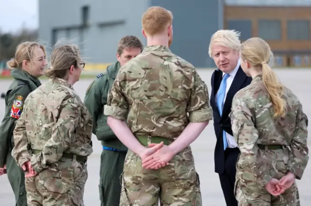 Boris Johnson talks to armed forces personnel