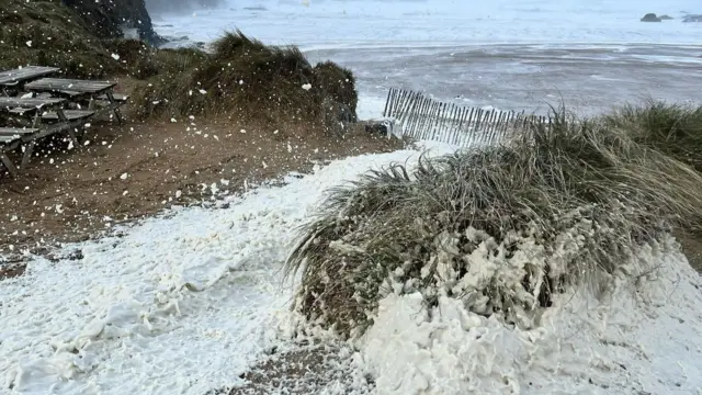 Sea foam at Poldhu Beach Cafe