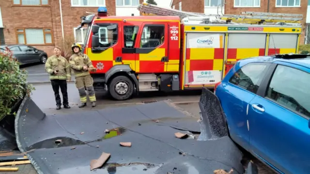 Damaged roofing and firefighters