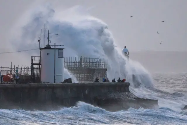 Waves crashing against the harbour wall Porthcawl, Wales on Friday morning