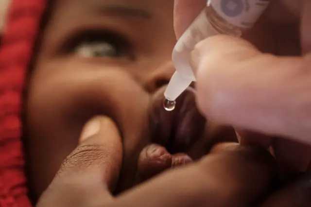 A child is vaccinated during a launching ceremony of the five-day polio vaccination campaign in high risk counties, targeting about two million children under five years old, in Kajiado, Kenya, on July 11, 2018.