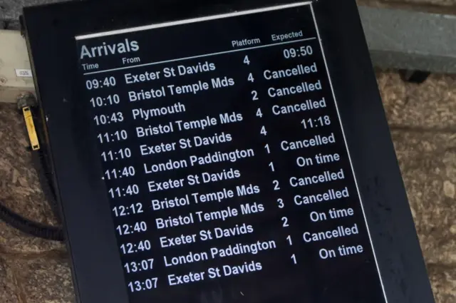 A notice board in Penzance train station shows cancellations during Storm Eunice