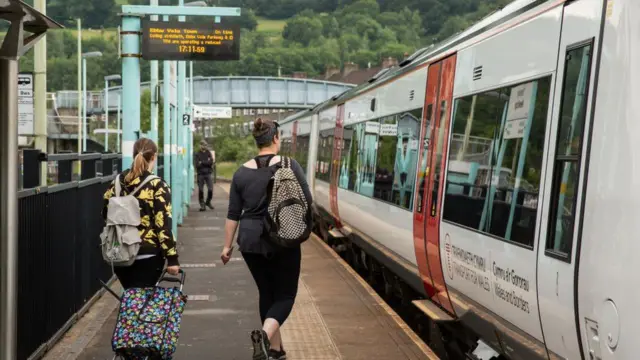 Passengers boarding train