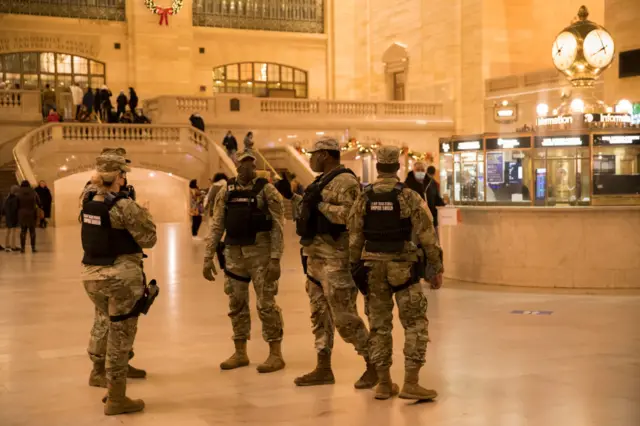 US army soldiers stand guard at Grand Central Station during New Year's Eve celebrations on 31 December 2021 in New York