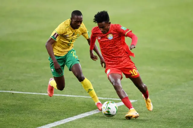 Abubkar (right) and Nyiko Mobbie of Malemodi Sundowns left of the screen