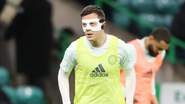 Celtic captain Callum McGregor is wearing a protective mask this evening
