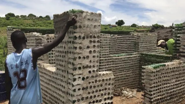 A charity in Mozambique using plastic bottles to build homes