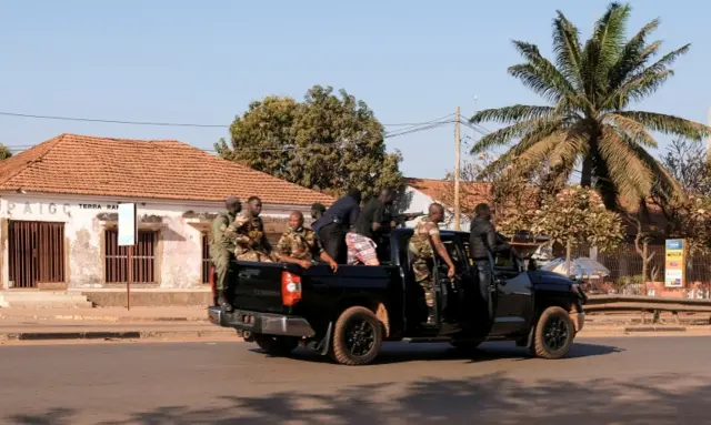 rmed soldiers move on the main artery of the capital after heavy gunfire around the presidential palace in Bissau, Guinea-Bissau - 1 February 2022.