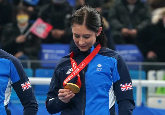 Eve Muirhead admires her Olympic gold medal