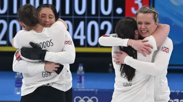 Team GB celebrate gold in the women's curling final