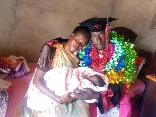 Ruot George Wal and his wife Nyatapa John hold their new baby girl.