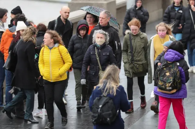 People in London wearing masks