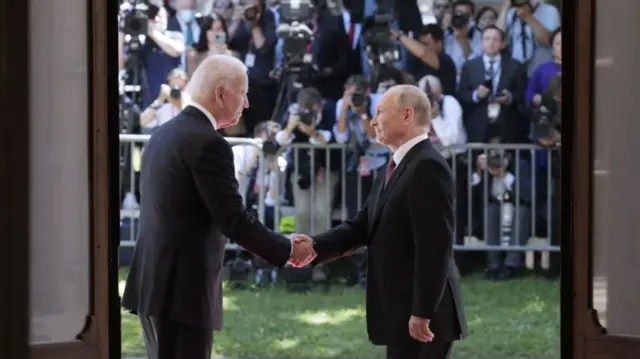 GENEVA, SWITZERLAND JUNE 16, 2021: US President Joe Biden (L) and Russia's President Vladimir Putin shake hands as they meet for talks at the Villa La Grange