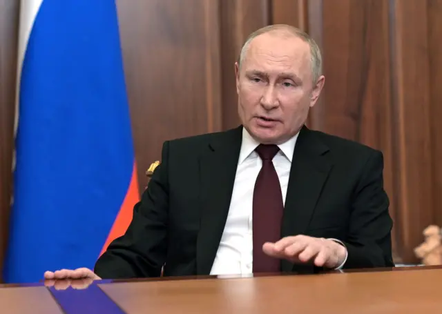 Vladimir Putin addressing Russians in a broadcast