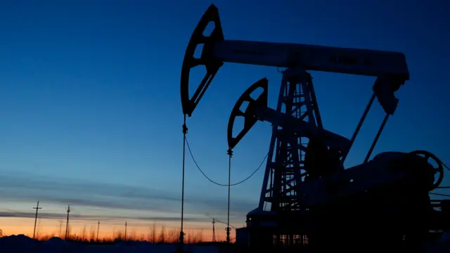 Pump jacks are seen at the Lukoil company owned Imilorskoye oil field outside the West Siberian city of Kogalym, Russia