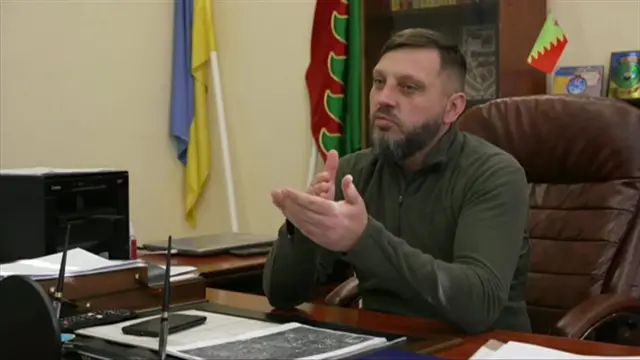 Avdiivka Mayor Vitaliy Barabash keeps a grenade launcher in his office