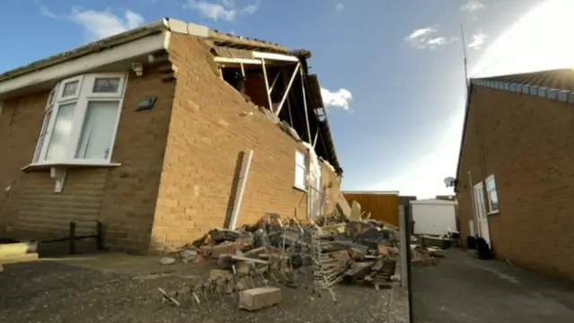 Damaged roof and rubble