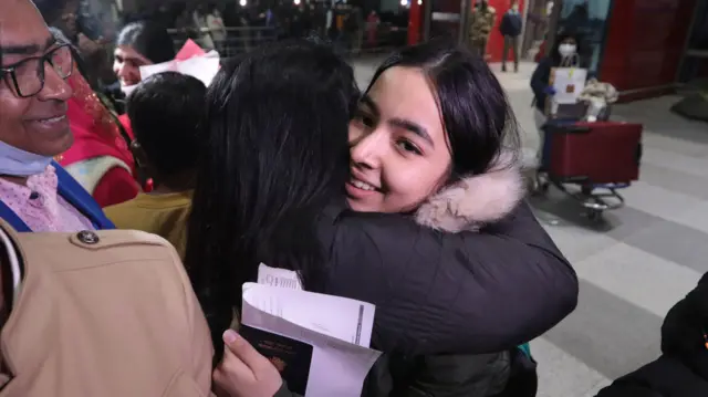 Indian students returning from Ukraine are received by their relatives amid the crisis, at Indira Gandhi International airport in New Delhi, India, 22 February 2022.