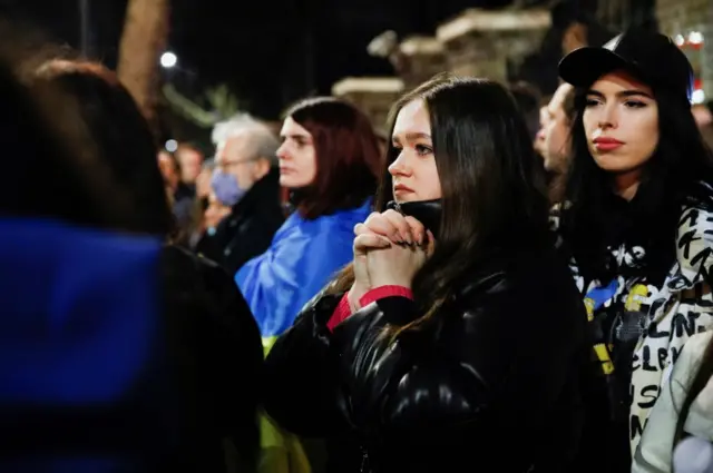 Woman gestures during pro-Ukrainian demonstration