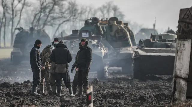 Russian servicemen and armoured vehicles stand on the road in Rostov region, Russia, 22 February 2022. On February 21, Russian President Vladimir Putin convened an extraordinary large meeting of the Russian Security Council, which discussed the recognition of the DNR and LNR.