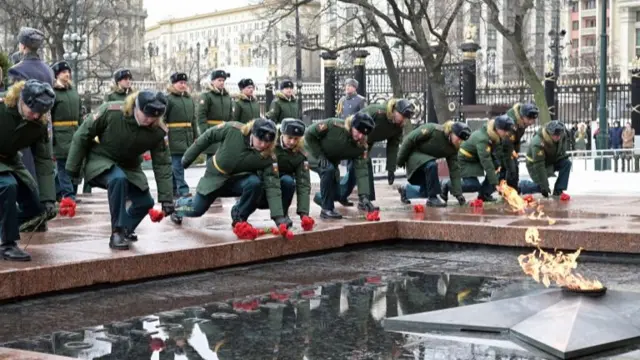 Russian servicemen attend a wreath-laying ceremony in Moscow, Russia.