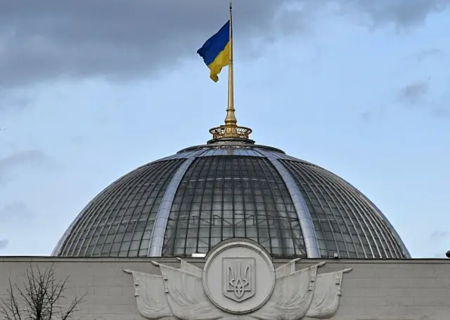 A Ukrainian flag flying on above the Rada