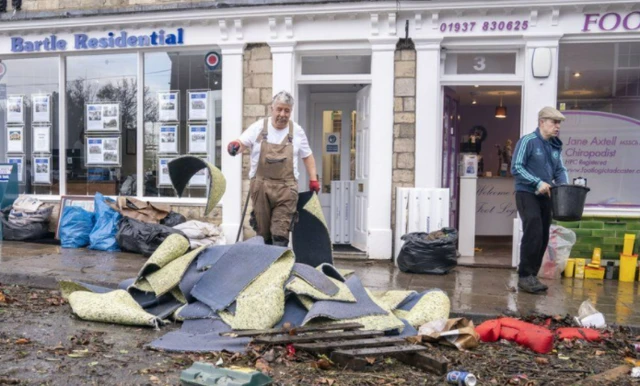 Cleaning up in Tadcaster after flooding.