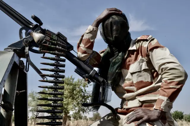 Niger Army soldier takes a breather during security patrol near the Nigerian border in Maradi State.