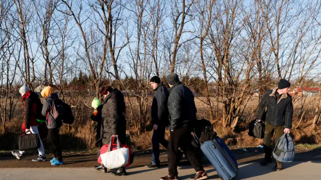 Ukrainians flee their country in the wake of Russian attacks