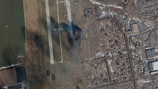 Satellite image showing smoke rising from Chuguev airbase