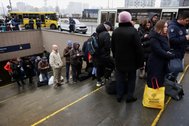 People line up at bus station in Kyiv on 24 February 2022