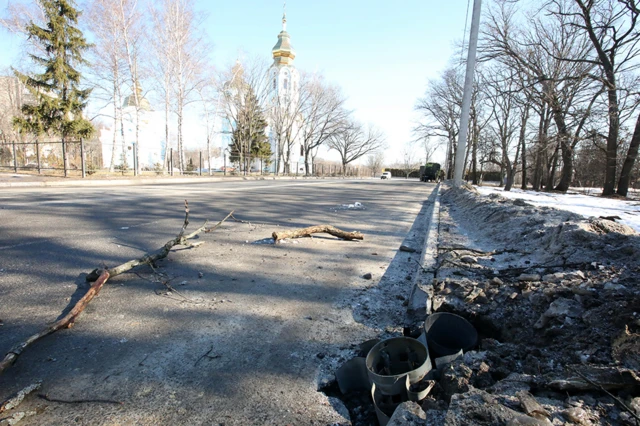 A rocket embedded in a road after shelling of a residential area in Kharkiv