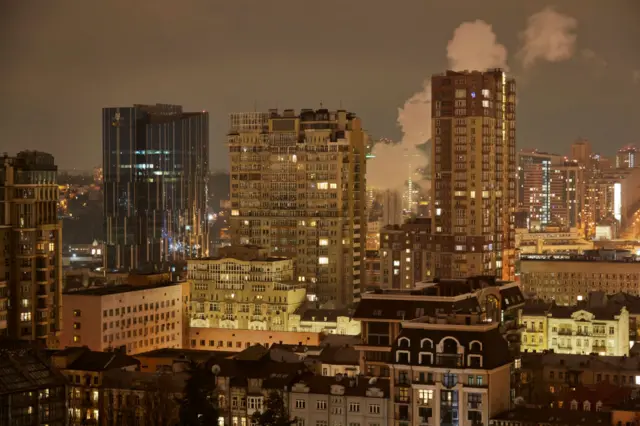 View of Kyiv at night with smoke in background