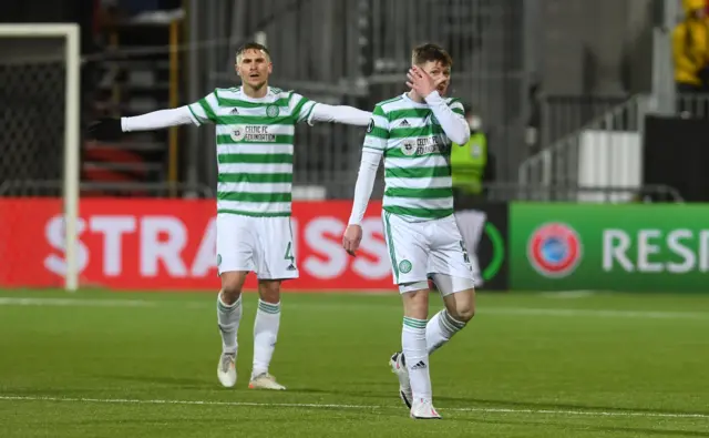 Celtic's Carl Starfelt (left) and James McCarthy are left dejected